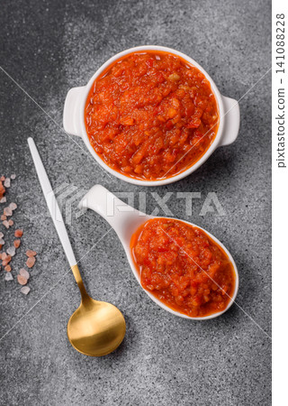 Red tomato Bolognese sauce with spices, salt, pepper, and herbs. A red sauce 141088228