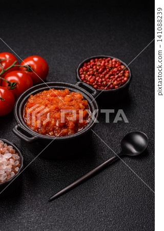 Red tomato Bolognese sauce with spices, salt, pepper, and herbs. A red sauce Red tomato Bolognese sauce with spices, salt, pepper, and herbs. A red sauce 141088239