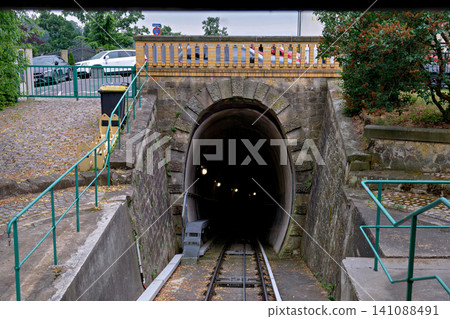 Stone arch tunnel entrance for a steep funicular railway track Stone arch tunnel entrance for a steep funicular railway track 141088491