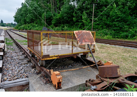 Old rusty metal railway handcart trolley on tracks in countryside Old rusty metal railway handcart trolley on tracks in countryside 141088511