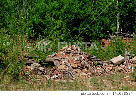 Closer view of a pile of shattered bricks and debris from a ruined structure Closer view of a pile of shattered bricks and debris from a ruined structure 141088554