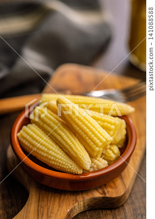 Stacked Baby Corn In A Ceramic Bowl On A Wooden Board Rustic Vegetable Side Dish 141088588