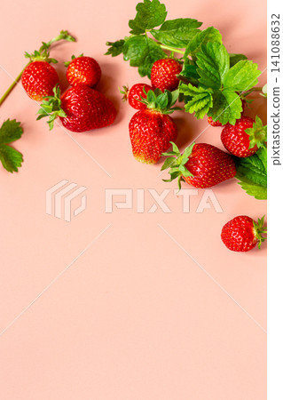 Ripe strawberries arranged in upper corner on pastel pink background Ripe strawberries arranged in upper corner on pastel pink background 141088632