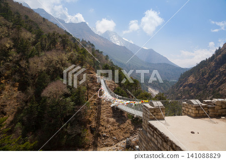 Imja river suspension bridge view along EBC trek, Nepal Imja river suspension bridge view along EBC trek, Nepal 141088829