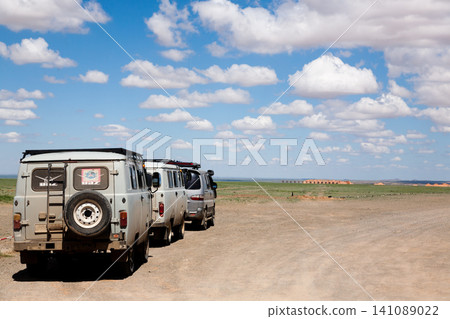 Off-road vehicles in remote region of Mongolia. Gobi desert area Off-road vehicles in remote region of Mongolia. Gobi desert area 141089022