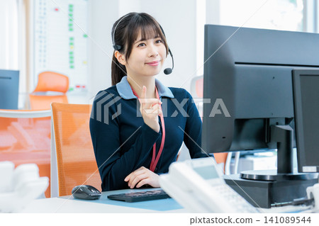 Image of a female call center operator Image of a female call center operator 141089544