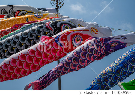 Carp streamer swimming in the blue sky in May Carp streamer swimming in the blue sky in May 141089592