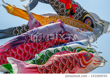 Carp streamer swimming in the blue sky in May Carp streamer swimming in the blue sky in May 141089593