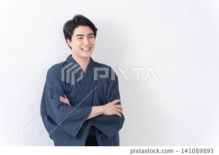 A man wearing a yukata A man wearing a yukata 141089893