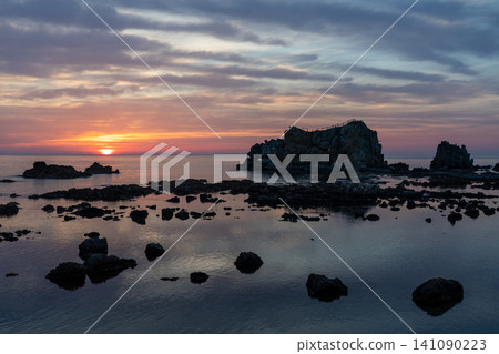 Sunset overlooking the Sea of Japan from a large rock in Fukaura Town, Aomori Prefecture Sunset overlooking the Sea of Japan from a large rock in Fukaura Town, Aomori Prefecture 141090223