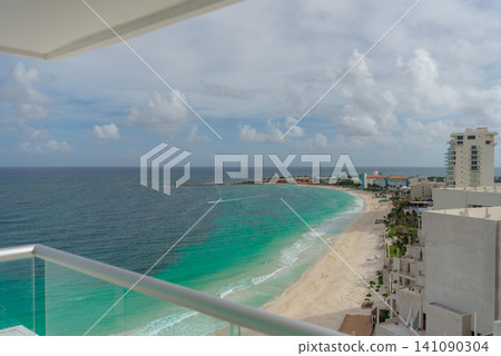 Aerial view of turquoise coastline with hotels and sandy beach from balcony Aerial view of turquoise coastline with hotels and sandy beach from balcony 141090304