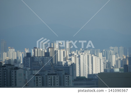 Urban cityscape and residential area view on a bright day Urban cityscape and residential area view on a bright day 141090367