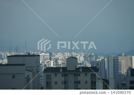Urban cityscape and residential area view on a bright day Urban cityscape and residential area view on a bright day 141090370