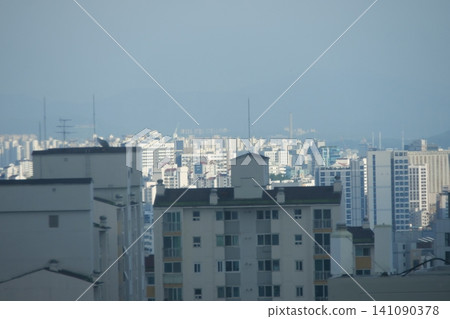 Urban cityscape and residential area view on a bright day Urban cityscape and residential area view on a bright day 141090378