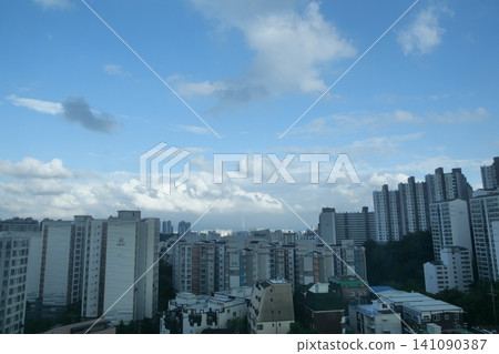 Urban cityscape and residential area view on a bright day Urban cityscape and residential area view on a bright day 141090387