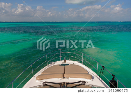 Yacht bow cruising over crystal clear turquoise water Yacht bow cruising over crystal clear turquoise water 141090475