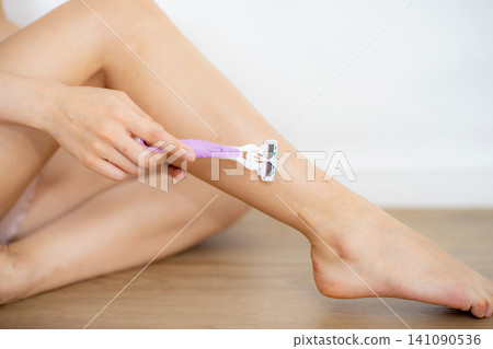 Japanese people remove unwanted hair with a razor. Japanese people remove unwanted hair with a razor. 141090536