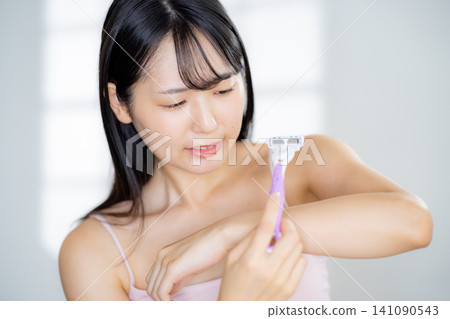 Hair removal image of a young woman Hair removal image of a young woman 141090543