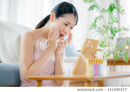 A young woman suffering from skin problems A young woman suffering from skin problems 141090557