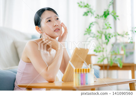 A young woman suffering from skin problems A young woman suffering from skin problems 141090560