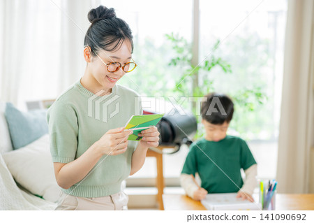 Family, living room, mom, bankbook Family, living room, mom, bankbook 141090692