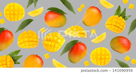 Colorful arrangement features ripe mangoes, juicy slices, and vibrant cubes 141090956