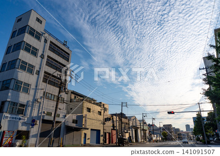 Cirrocumulus clouds and cityscape Cirrocumulus clouds and cityscape 141091507