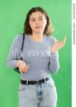 Discouraged or puzzled female person is trying to recall necessary information 141091626