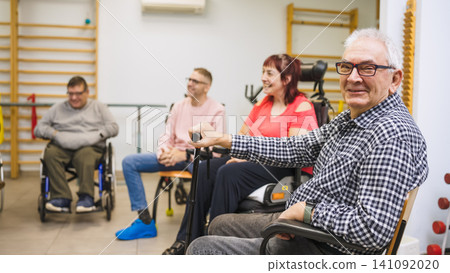 Group of people with disability participating in physical therapy Group of people with disability participating in physical therapy 141092020