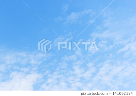 beautiful blue sky and white fluffy group of clouds with sunrise in the morning, natural background beautiful blue sky and white fluffy group of clouds with sunrise in the morning, natural background 141092154