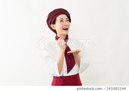 一位身穿麵包師制服的女子 一位身穿麵包師制服的女子 141092244