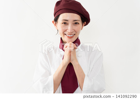 一位身穿麵包師制服的女子 一位身穿麵包師制服的女子 141092290