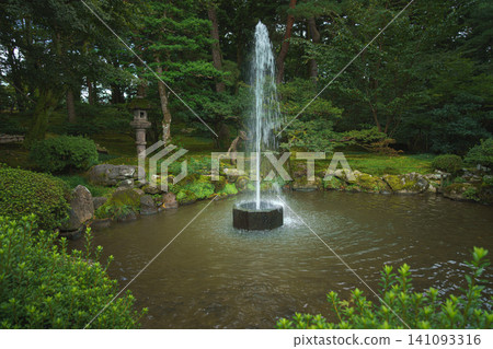 Kanazawa, Japan - Oct 6 2024, panoramic view of the fountain in the middle of the pond, the oldest fountain in Japan, in Kenroku-en, without people, at daytime, Park Kanazawa, Japan Kanazawa, Japan - Oct 6 2024, panoramic view of the fountain in the middle of the pond, the oldest fountain in Japan, in Kenroku-en, without people, at daytime, Park Kanazawa, Japan 141093316