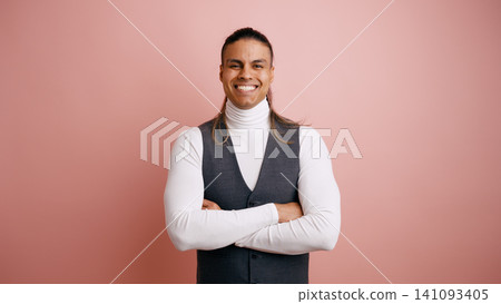 Latino man smiling confidently with arms crossed Latino man smiling confidently with arms crossed 141093405