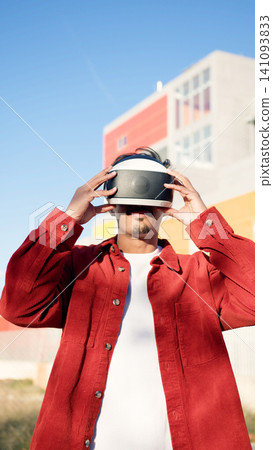 Moroccan man experiencing virtual reality in metaverse 141093833