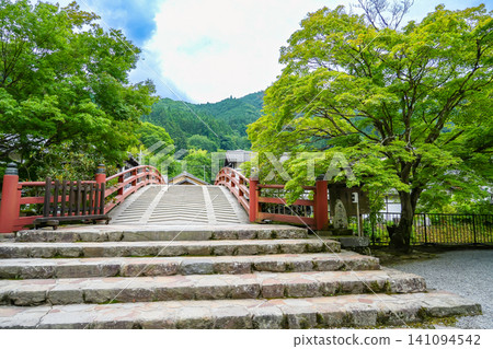 Taiko Bridge at the entrance to Murō-ji Temple in Uda City, Nara Prefecture, where the fresh greenery is beautiful. Taiko Bridge at the entrance to Murō-ji Temple in Uda City, Nara Prefecture, where the fresh greenery is beautiful. 141094542