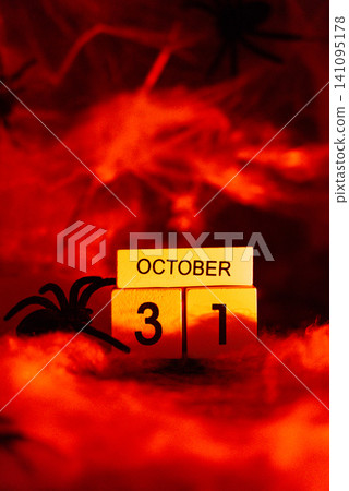Atmospheric Halloween concept symbolizing arrival of October 31, combining seasonal decoration dramatic lighting and festive tradition Atmospheric Halloween concept symbolizing arrival of October 31, combining seasonal decoration dramatic lighting and festive tradition 141095178