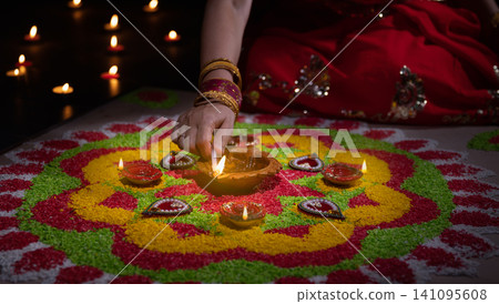 Traditional diya lamps lit during diwali celebration 141095608