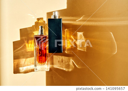 Perfume fragrance bottles creating light reflections on wall 141095657