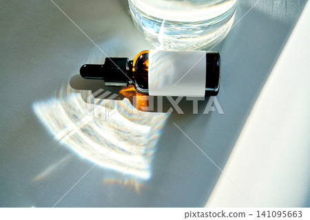 Exosome inspired serum dropper bottle on table Exosome inspired serum dropper bottle on table 141095663