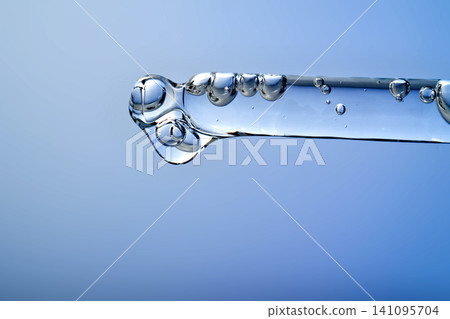 Pipette dripping serum with hyaluronic acid for skincare Pipette dripping serum with hyaluronic acid for skincare 141095704