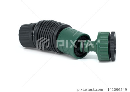 Green and black garden hose connector with ribbed texture on white background Green and black garden hose connector with ribbed texture on white background 141096249