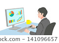 A man in a suit working on a computer 141096657
