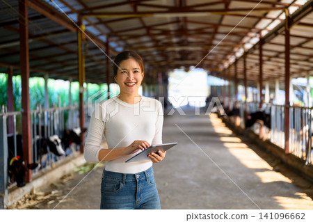 Portrait woman farmer on dairy farm Portrait woman farmer on dairy farm 141096662