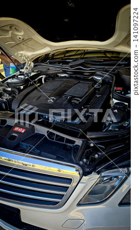 Mercedes V6 Engine Bay Under Open Hood Showing Car Motor Components and all engine mechanical 141097224