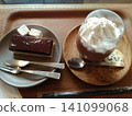 Snack time with chocolate cake and a chocolate drink with plenty of cream. 141099068