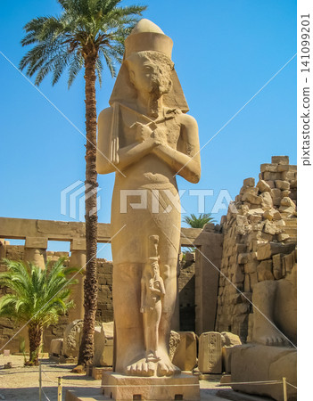 Pharaoh statue in anscient Temple of Karnak in Luxor - Ruined Thebes Egypt Pharaoh statue in anscient Temple of Karnak in Luxor - Ruined Thebes Egypt 141099201
