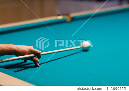 Billiard player at billiard table or snooker billiards pool sport game. 141099355