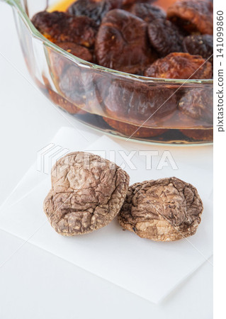 Rehydrating dried shiitake mushrooms Rehydrating dried shiitake mushrooms 141099860