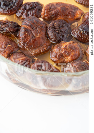 Rehydrating dried shiitake mushrooms Rehydrating dried shiitake mushrooms 141099881